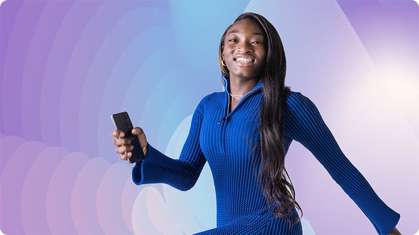 Person in a blue long-sleeve dress holding a black smartphone against a purple and blue gradient background with circular patterns.